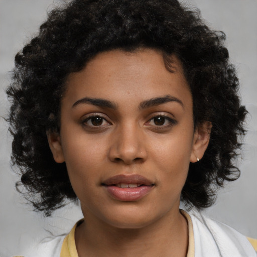 Joyful latino young-adult female with medium  black hair and brown eyes