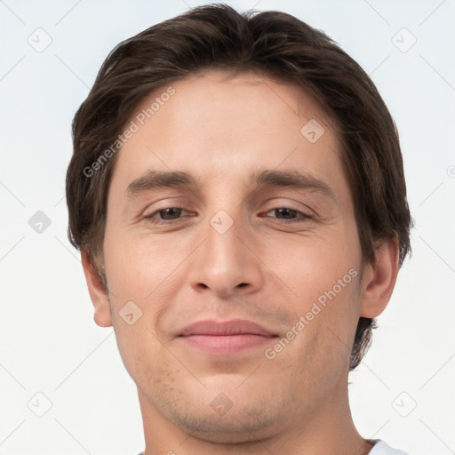 Joyful white young-adult male with short  brown hair and brown eyes