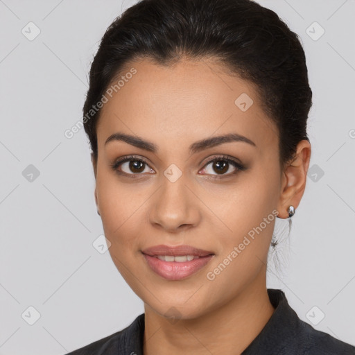 Joyful latino young-adult female with long  brown hair and brown eyes