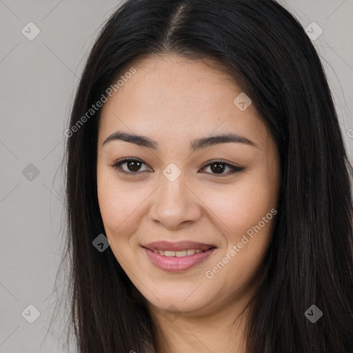 Joyful latino young-adult female with long  brown hair and brown eyes