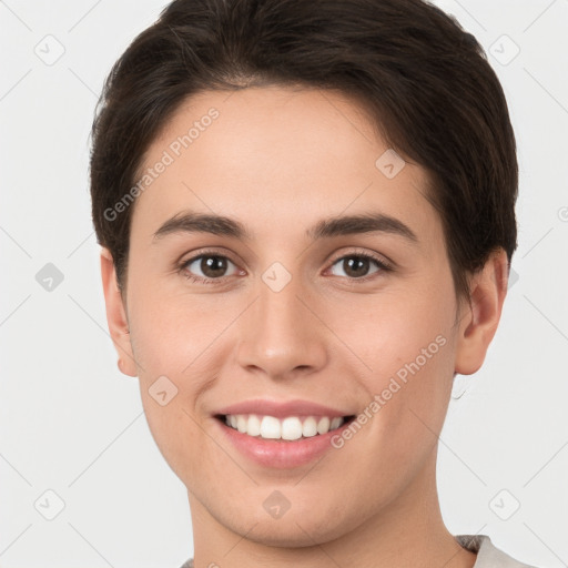 Joyful white young-adult female with short  brown hair and brown eyes