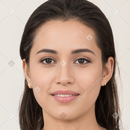 Joyful white young-adult female with long  brown hair and brown eyes