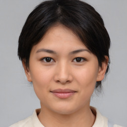 Joyful asian young-adult female with medium  brown hair and brown eyes