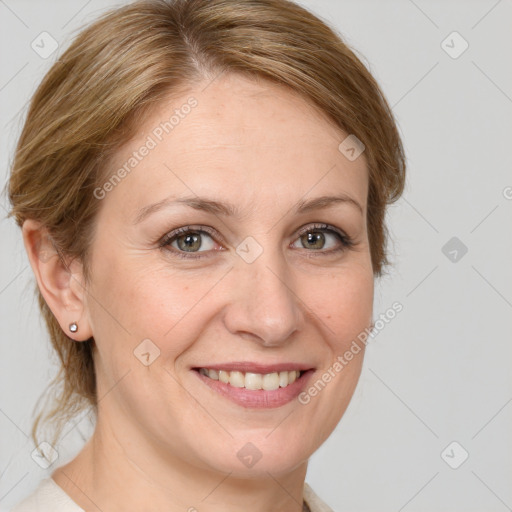 Joyful white adult female with medium  brown hair and green eyes