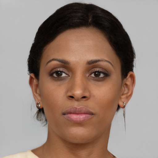 Neutral black young-adult female with short  brown hair and brown eyes