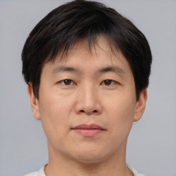 Neutral asian young-adult male with short  brown hair and brown eyes