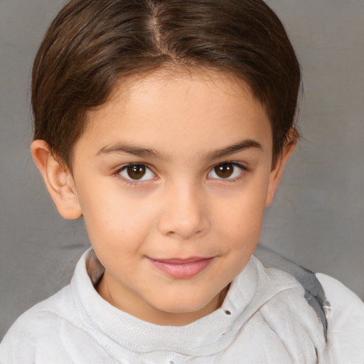 Joyful white child female with short  brown hair and brown eyes