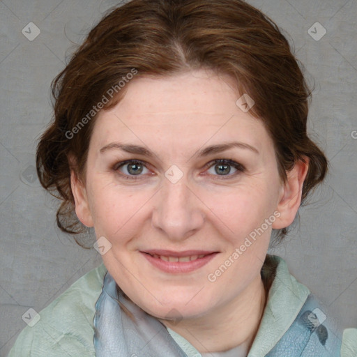 Joyful white adult female with medium  brown hair and blue eyes