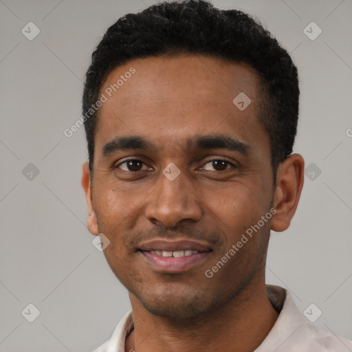 Joyful latino young-adult male with short  black hair and brown eyes