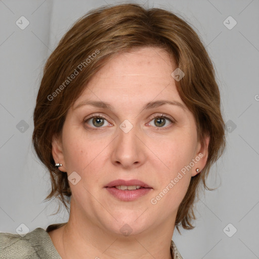 Joyful white adult female with medium  brown hair and blue eyes