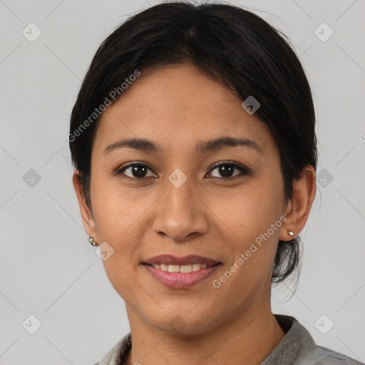 Joyful latino young-adult female with medium  brown hair and brown eyes