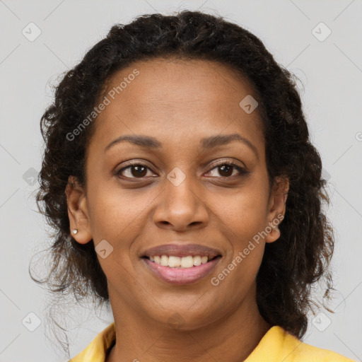 Joyful black young-adult female with medium  brown hair and brown eyes