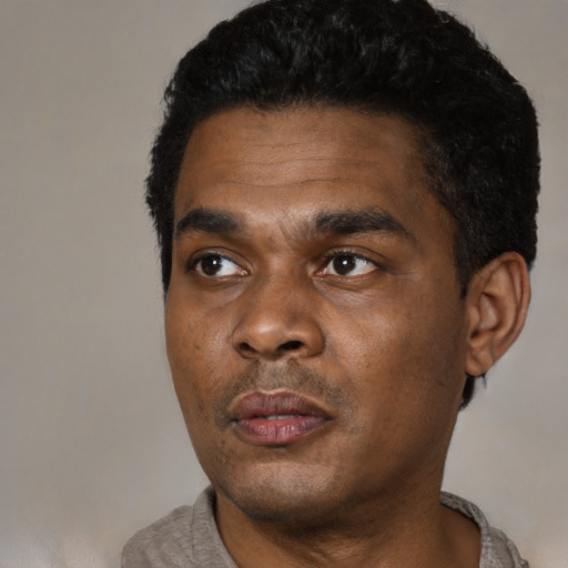 Neutral black young-adult male with short  black hair and brown eyes