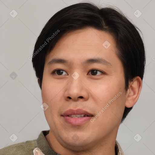 Joyful asian young-adult male with short  brown hair and brown eyes