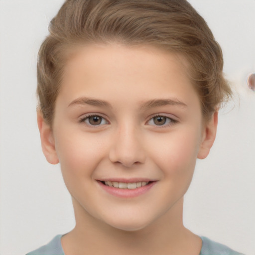 Joyful white child female with short  brown hair and brown eyes