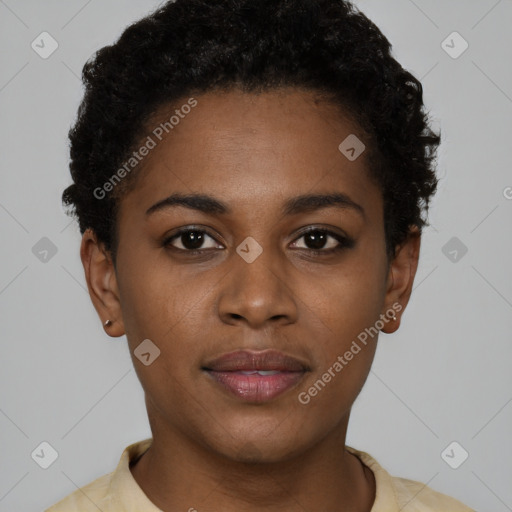 Joyful black young-adult female with short  black hair and brown eyes