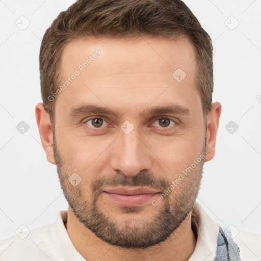 Joyful white young-adult male with short  brown hair and brown eyes