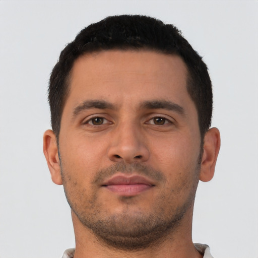 Neutral latino young-adult male with short  brown hair and brown eyes