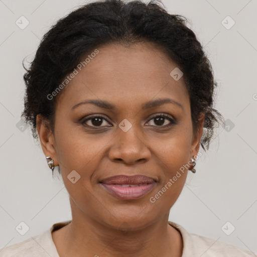 Joyful black adult female with short  brown hair and brown eyes