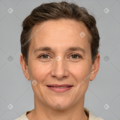 Joyful white adult female with short  brown hair and brown eyes