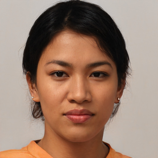 Joyful asian young-adult female with medium  black hair and brown eyes