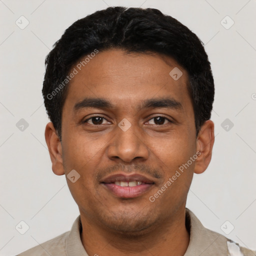 Joyful latino young-adult male with short  black hair and brown eyes