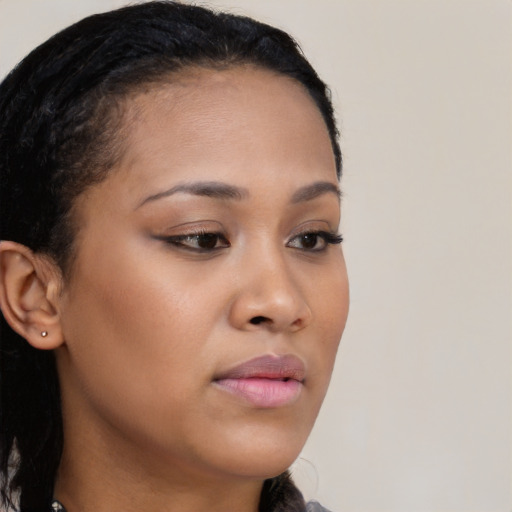 Neutral black young-adult female with long  brown hair and brown eyes