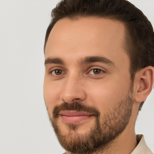 Joyful white young-adult male with short  brown hair and brown eyes