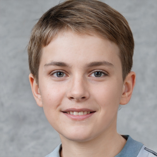 Joyful white child female with short  brown hair and grey eyes