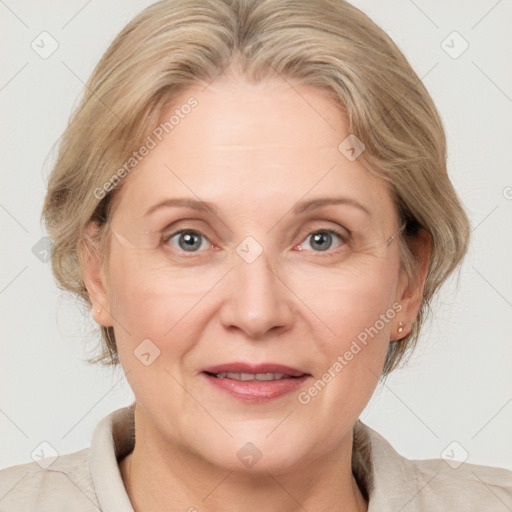 Joyful white adult female with medium  brown hair and blue eyes