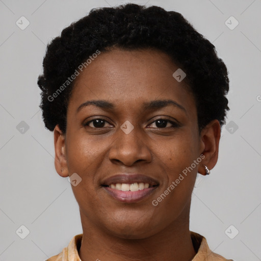 Joyful black young-adult female with short  black hair and brown eyes