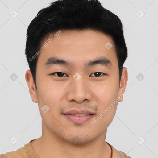 Joyful asian young-adult male with short  black hair and brown eyes