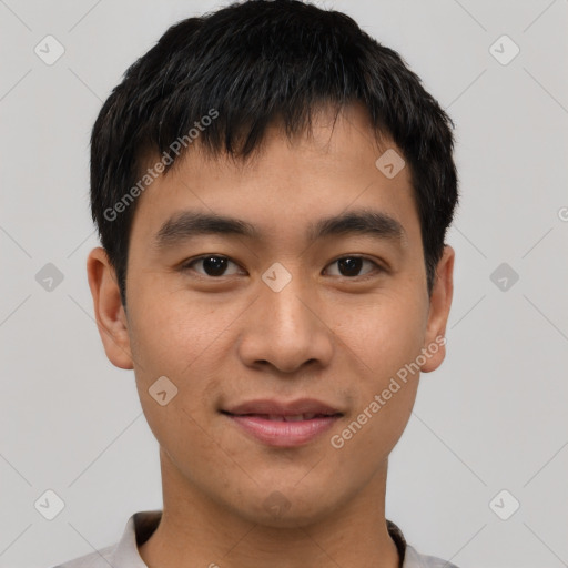 Joyful asian young-adult male with short  black hair and brown eyes