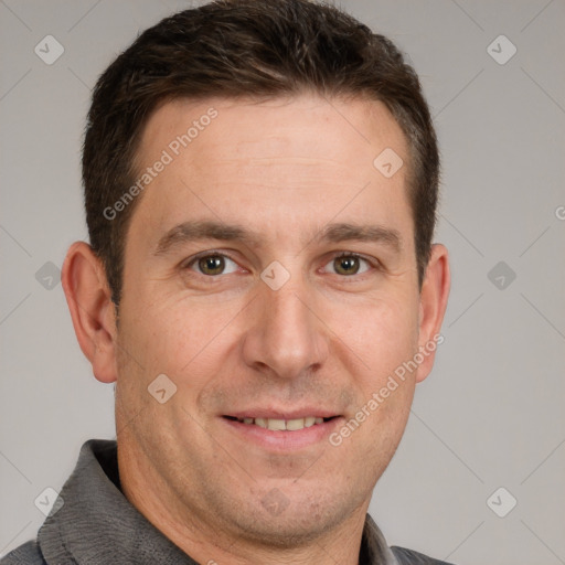 Joyful white adult male with short  brown hair and grey eyes