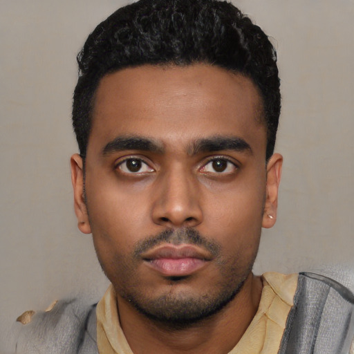 Neutral latino young-adult male with short  black hair and brown eyes
