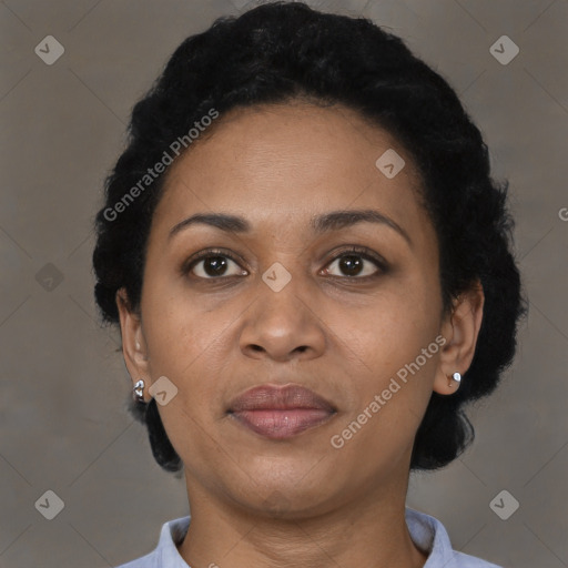 Joyful black adult female with short  brown hair and brown eyes