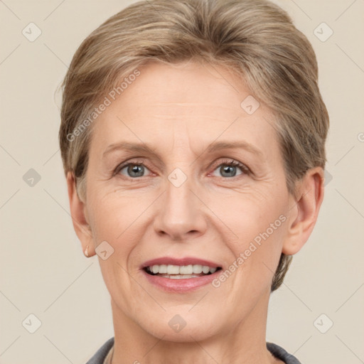 Joyful white adult female with short  brown hair and grey eyes