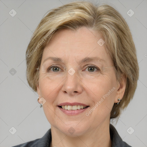 Joyful white adult female with medium  brown hair and grey eyes