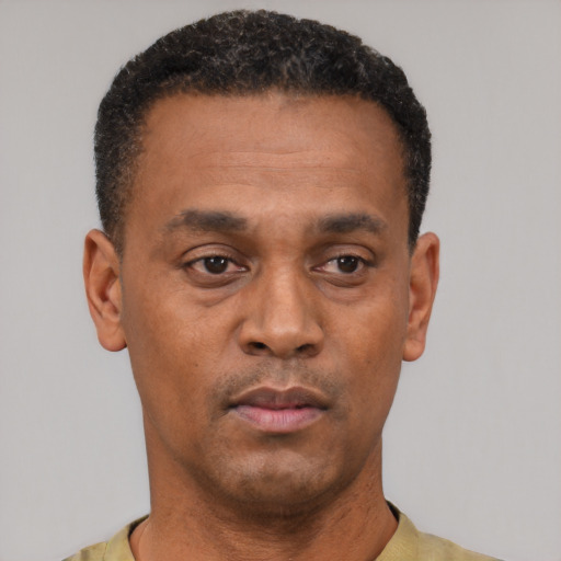 Neutral black young-adult male with short  black hair and brown eyes