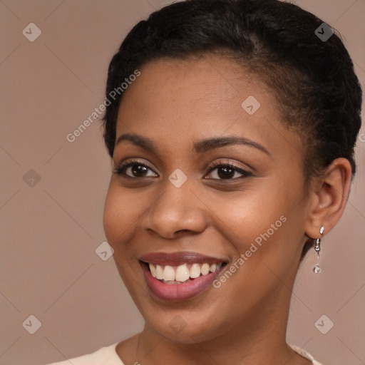 Joyful black young-adult female with long  brown hair and brown eyes