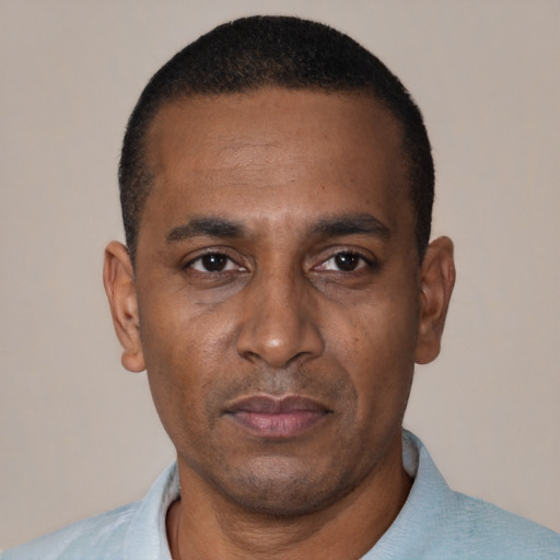 Neutral black adult male with short  black hair and brown eyes