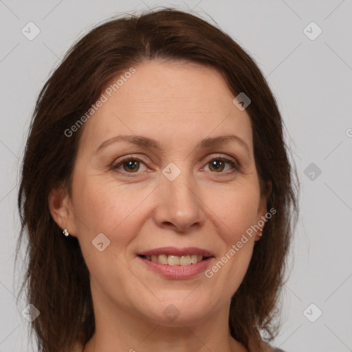 Joyful white adult female with medium  brown hair and brown eyes