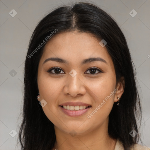 Joyful latino young-adult female with long  brown hair and brown eyes