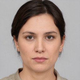 Neutral white young-adult female with medium  brown hair and brown eyes