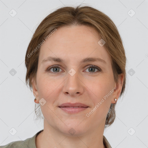 Joyful white adult female with medium  brown hair and grey eyes