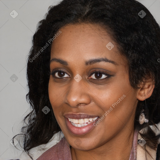 Joyful black young-adult female with long  black hair and brown eyes