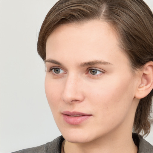 Neutral white young-adult female with medium  brown hair and grey eyes