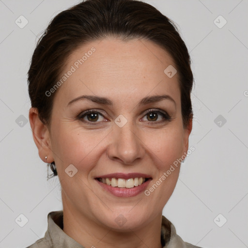 Joyful white adult female with short  brown hair and brown eyes