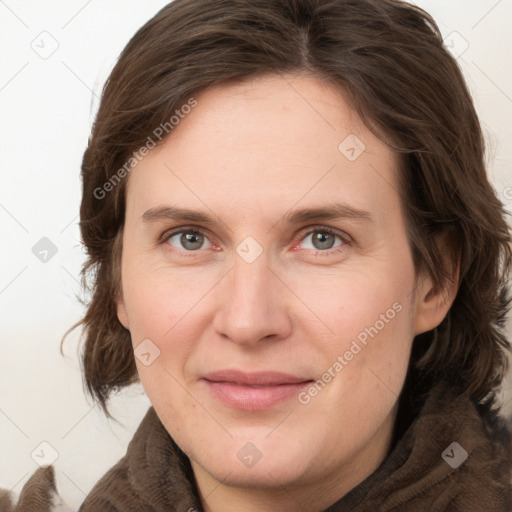 Joyful white young-adult female with medium  brown hair and blue eyes