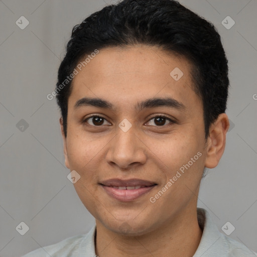 Joyful latino young-adult male with short  black hair and brown eyes